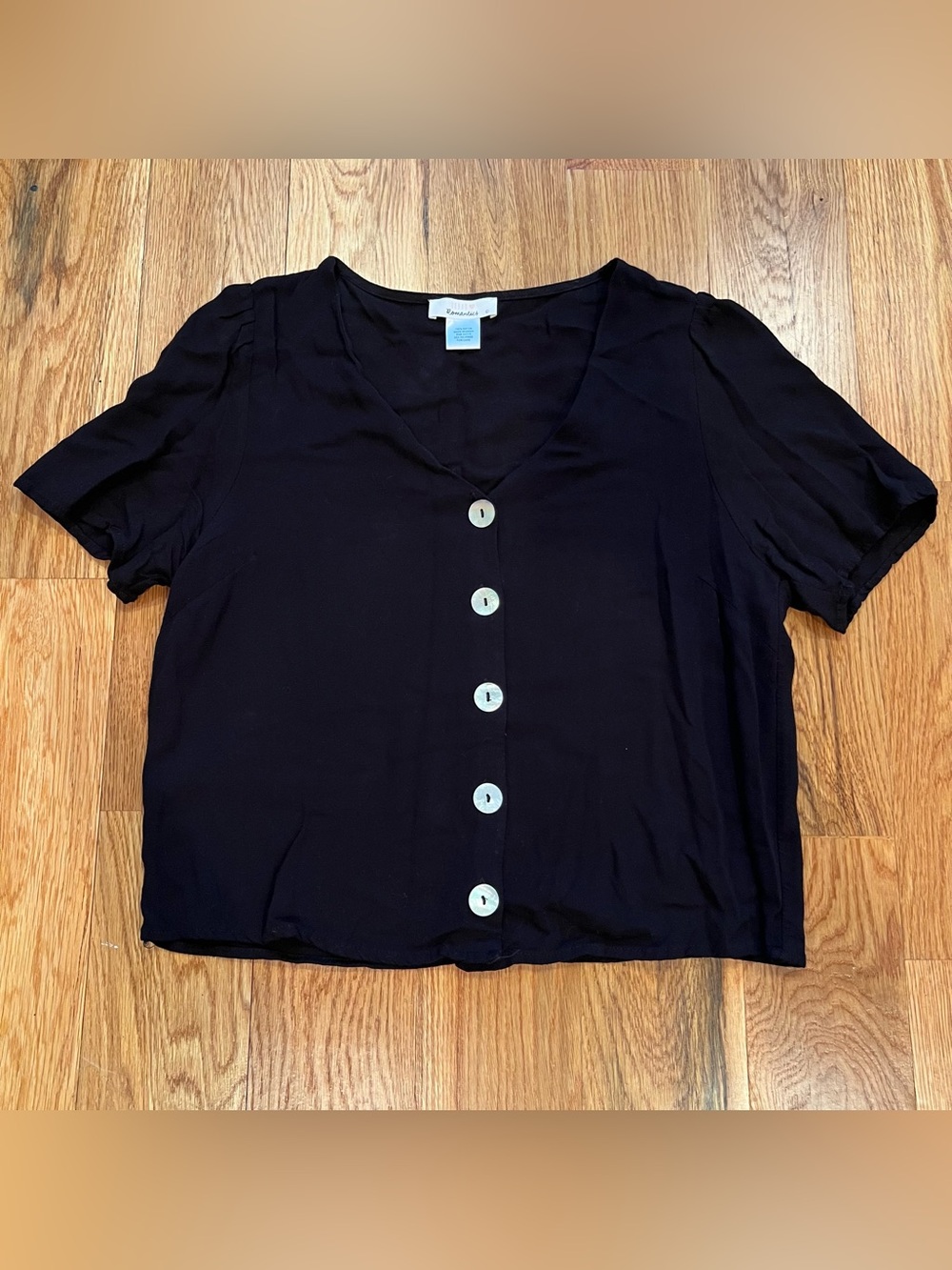 Black short sleeve top with mother of pearl buttons